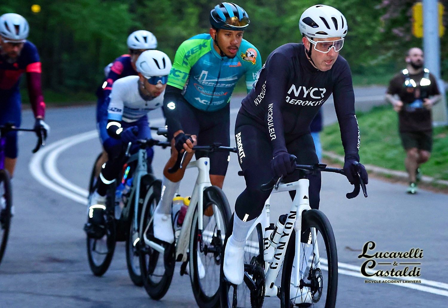 David riding with a group of cyclists in a road race